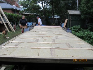Jump to an insulated, re-levelled trailer and the first piece of plywood going in place.